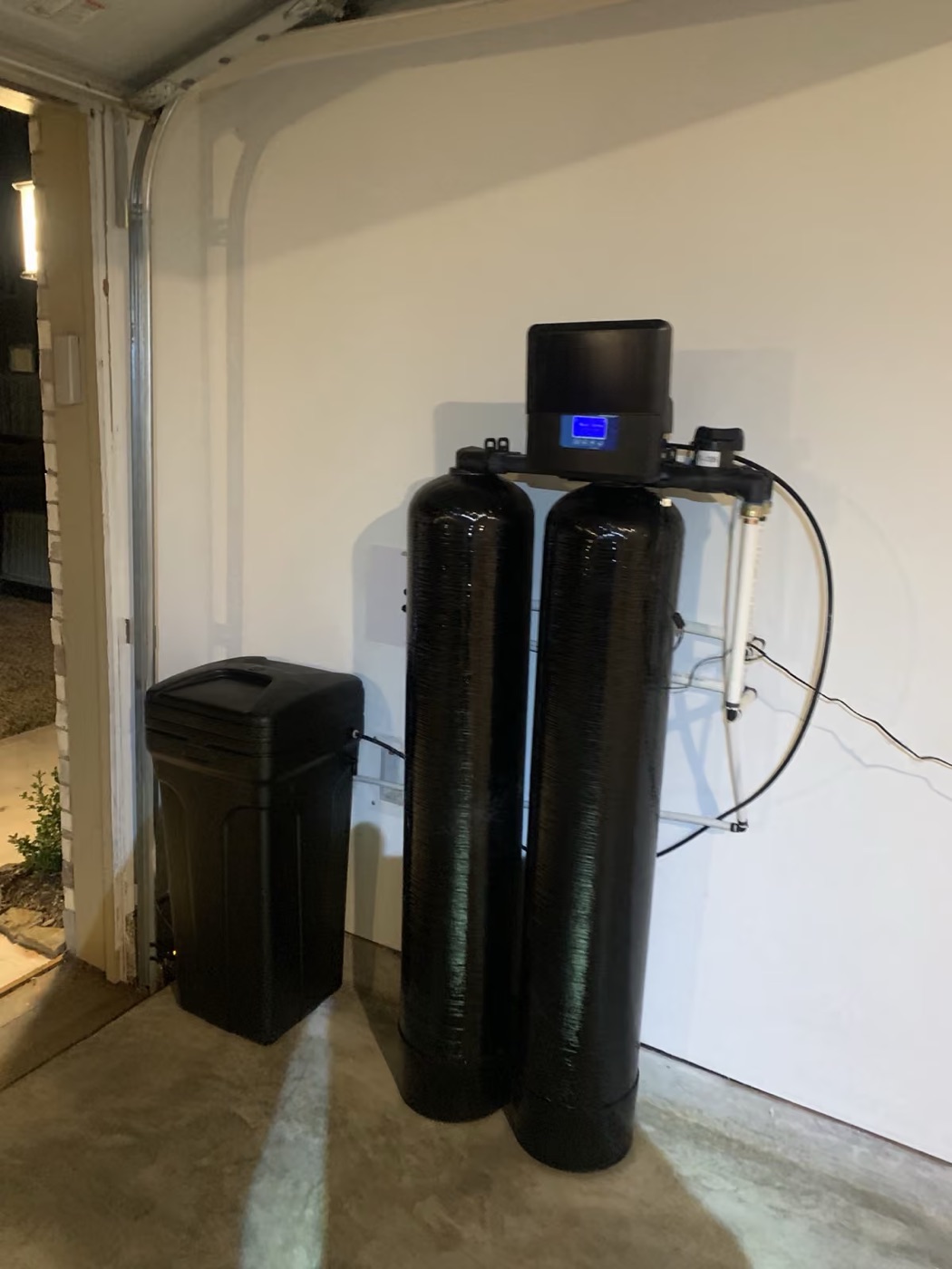 Dual-tank system and brine tank just inside the garage door
